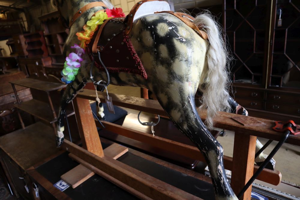 An Ayres-type rocking horse on wooden frame, length 130cm height 108cm (a.f.)